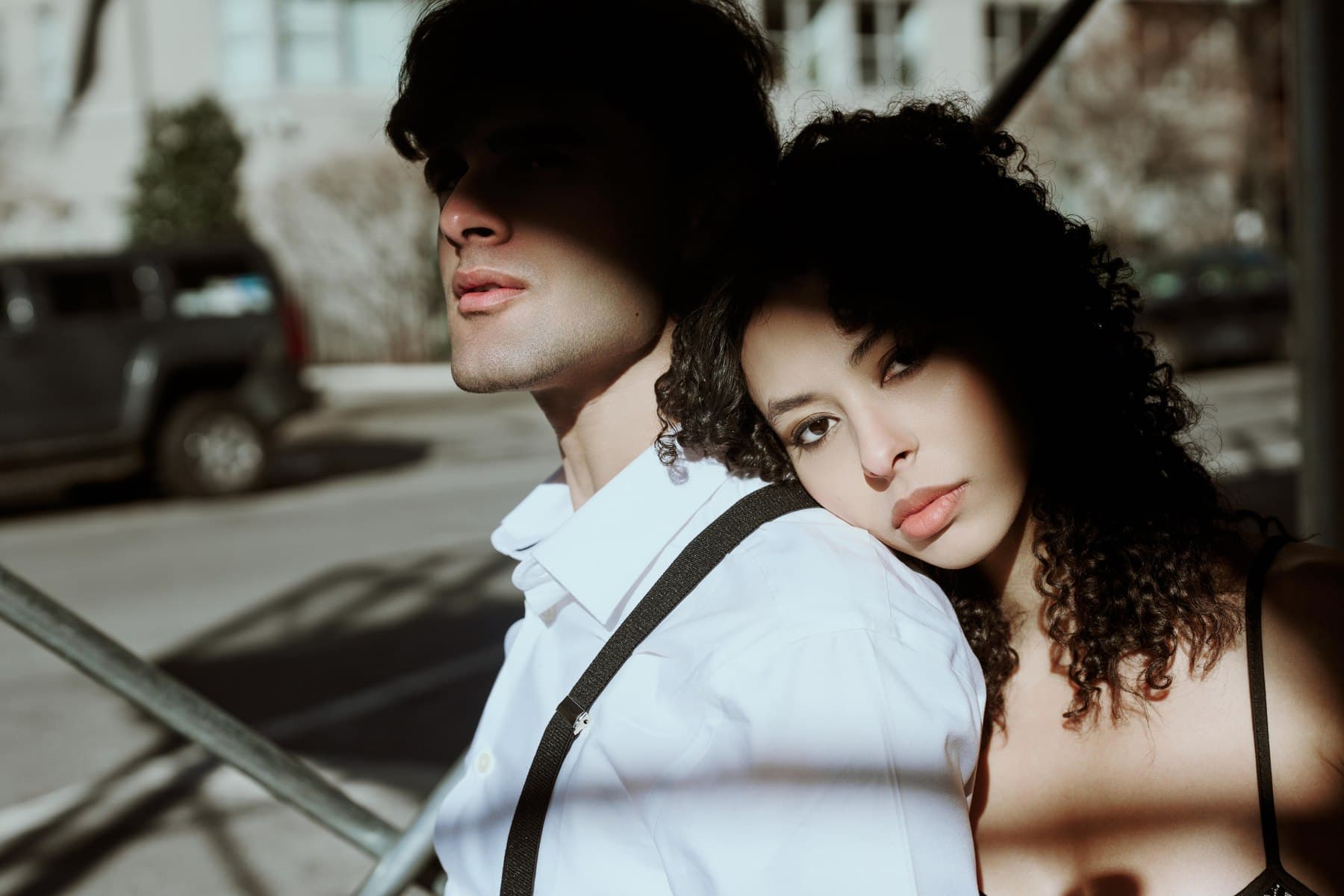 Jess and a fellow model in a black and white duo editorial, arms interlaced