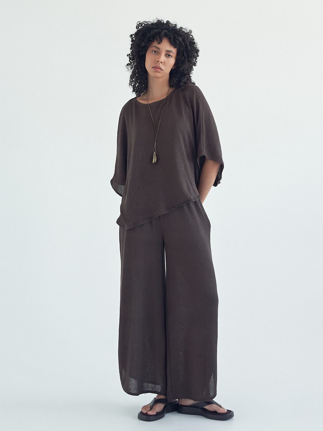 Test frame: full length standing in the mocha knit set, arms at her sides