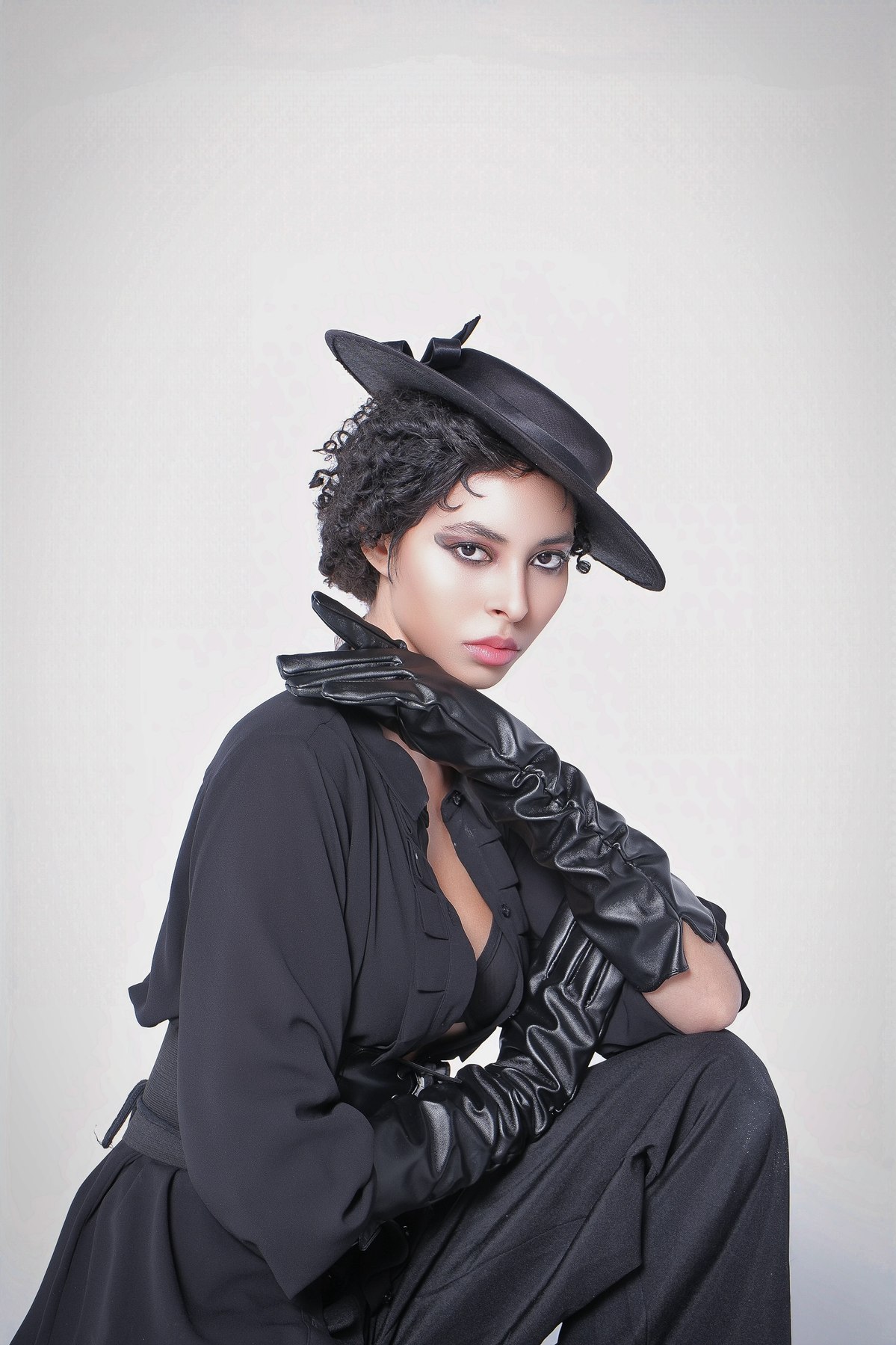 Jess in a boater hat and leather gloves — GOJI editorial